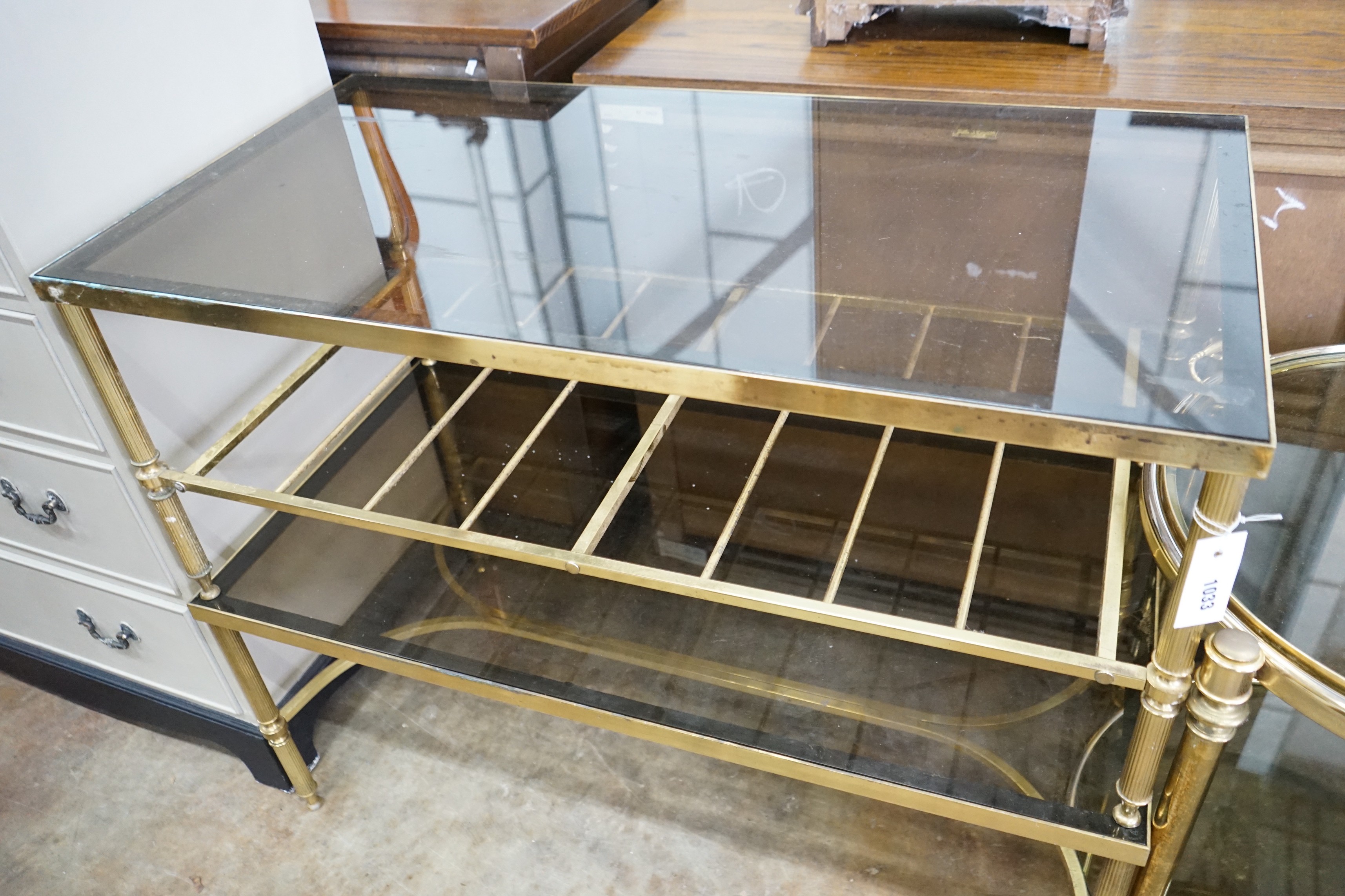 A brass and smoked glass two tier rectangular coffee table, width 99cm, depth 51cm, height 41cm